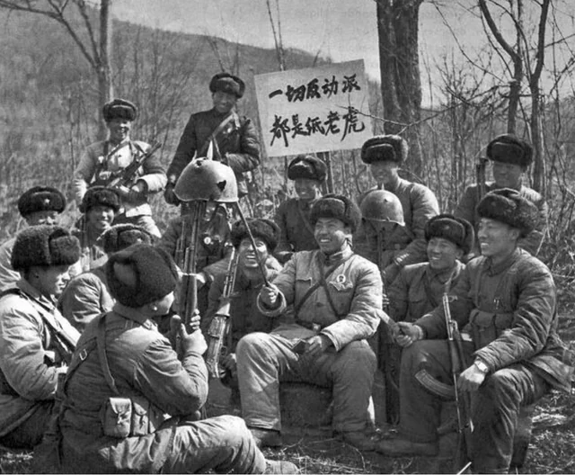 Chinese PLA soldiers posing with a captured Soviet helmet after the Zhenbao Island clashes in 1969